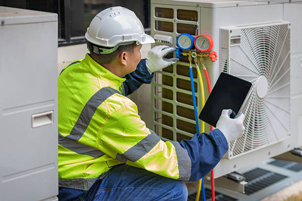 Professional Ac Installation technician working in Falkville, AL